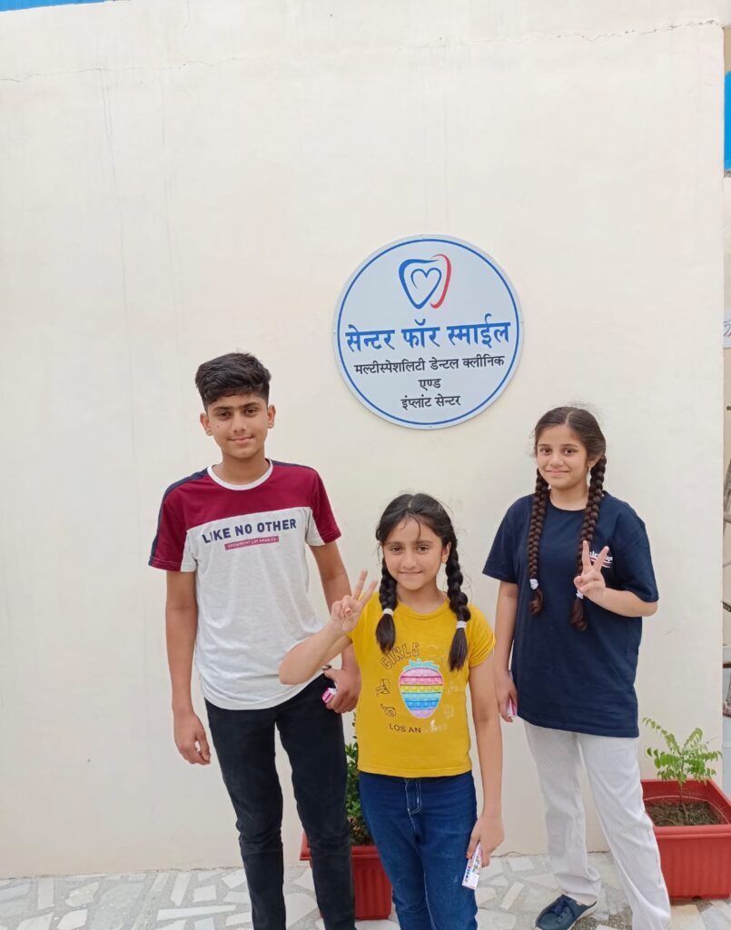Dentist checking teeth of a child during routine dental visit